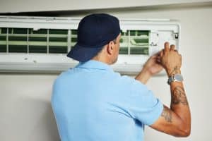 image of AC system repair by heating and cooling contractor